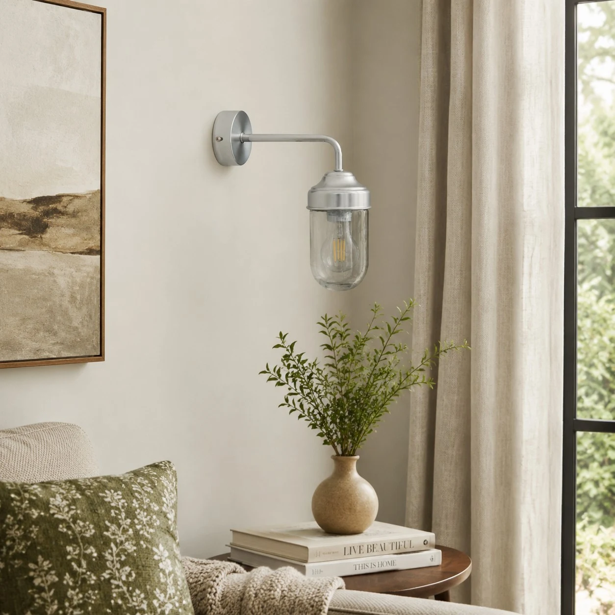 Aluminum glass wall sconce installed beside a sofa and window
