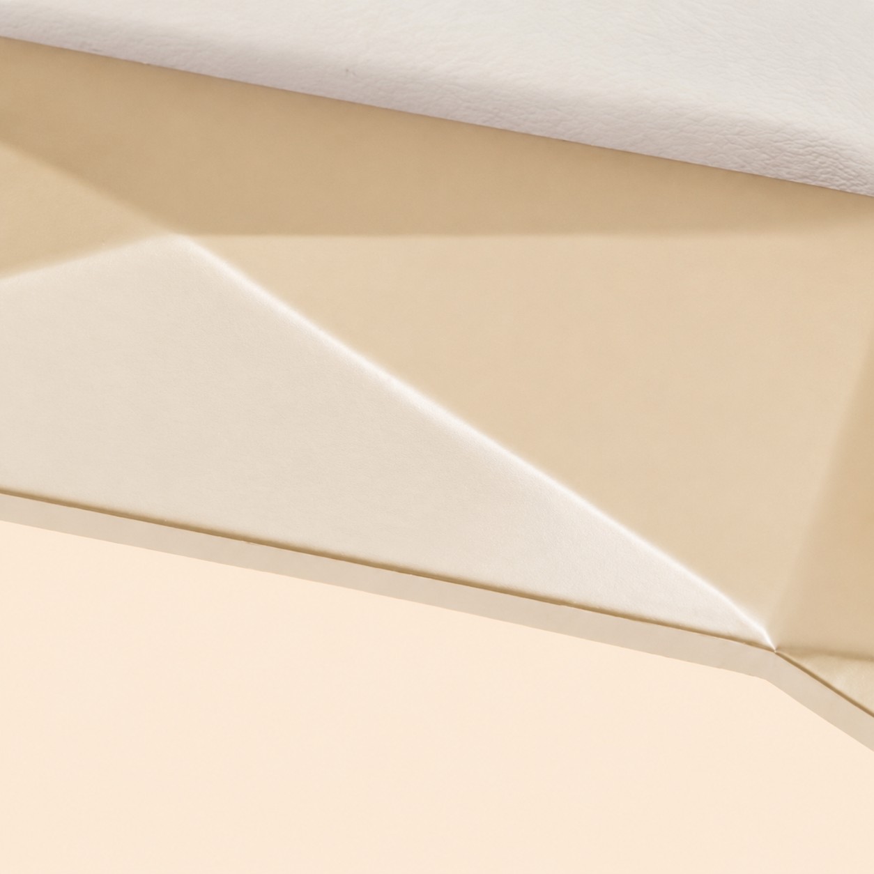 Close-up of the ceiling mount and faceted gold surface