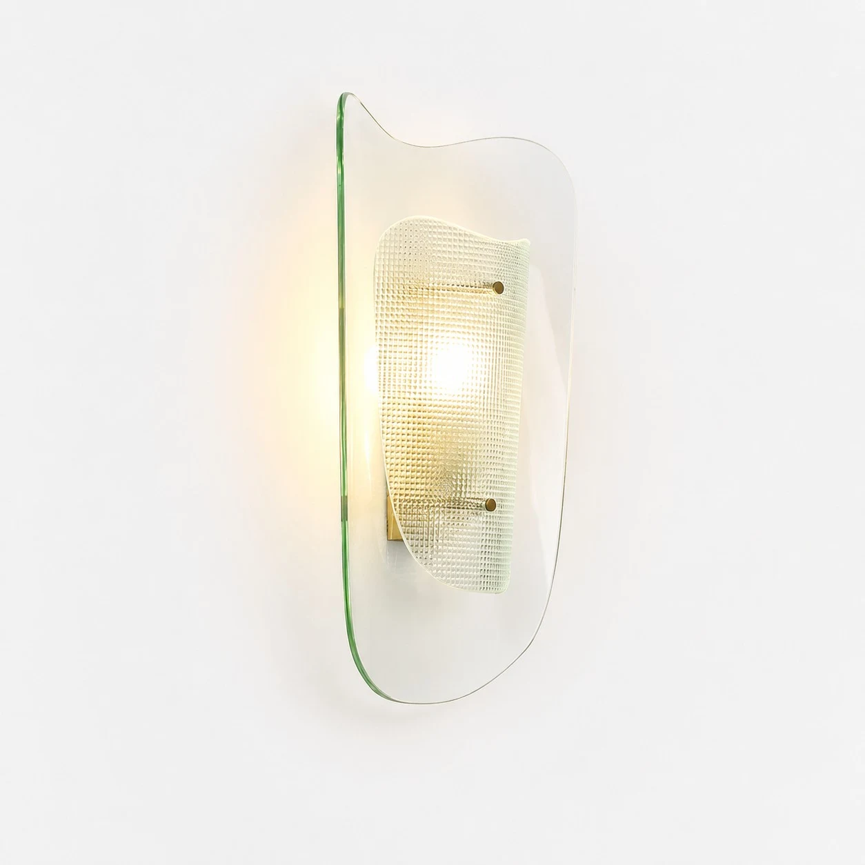Clear glass wall sconce shown illuminated on a white background