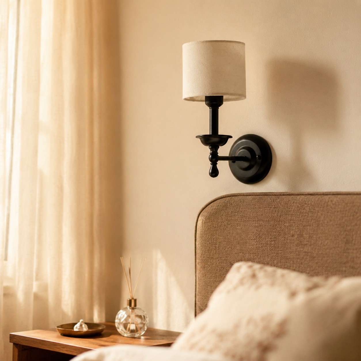 Vintage fabric shade wall sconce styled beside a bed