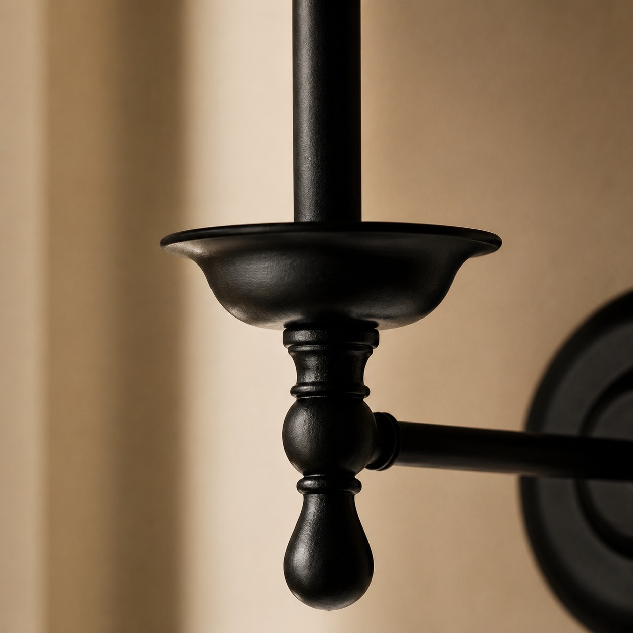 Close view of wrought iron wall sconce arm