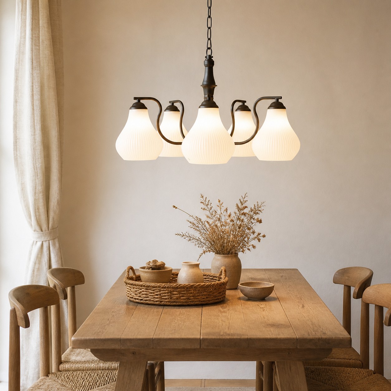 Five-heads chandelier above a wood dining table