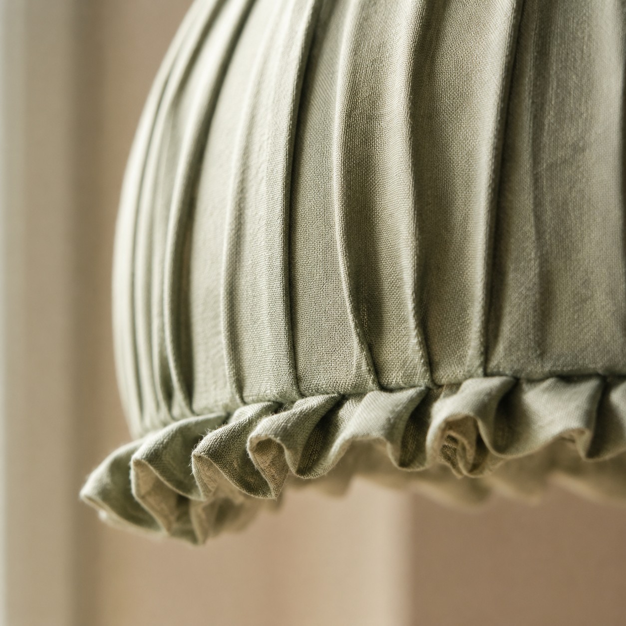 Close view of pleated fabric shade edge