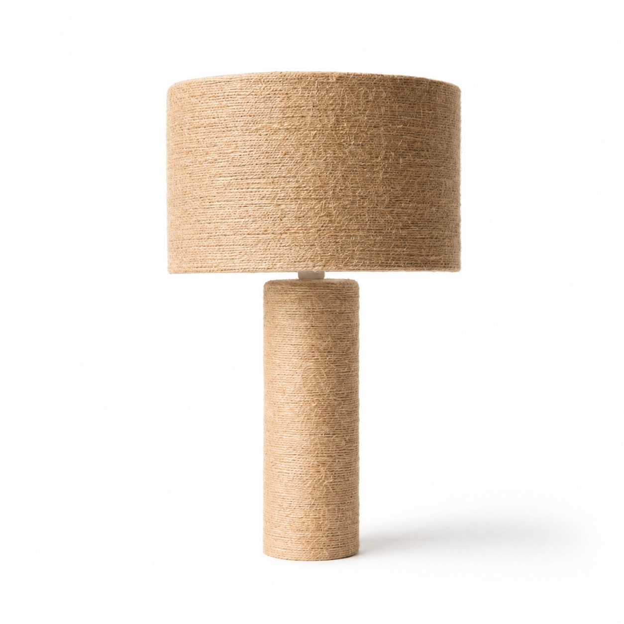Woven jute cylinder table lamp on a white background